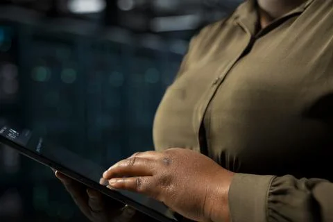 Close up of data center engineer using tablet to optimize network infrastructure Stock Photos