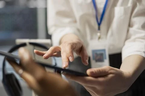 Close up of data center engineering team using tablet to inspect gear Stock Photos