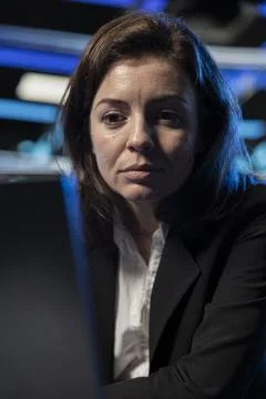 Close up of data center female engineer using laptop used to modify settings Stock Photos