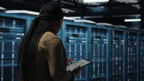 Close up of data center programmer doing data analysis on tablet Stock Footage 317207335