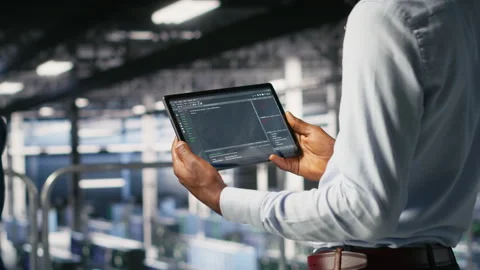 Close up of data center programmer looking at code debugging tools on tablet Stock-Footage 310276262