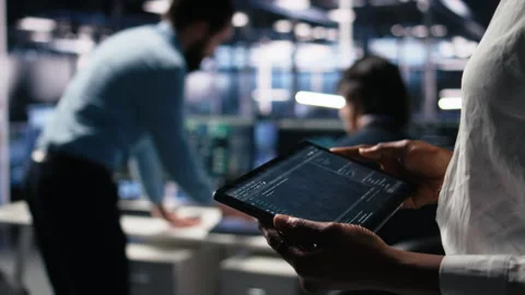 Close up of data center programmer using tablet, writing code Stock Footage 313636186