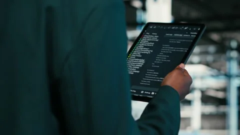 Close up of data center programmer using tablet app to write code Stock-Footage 329945232