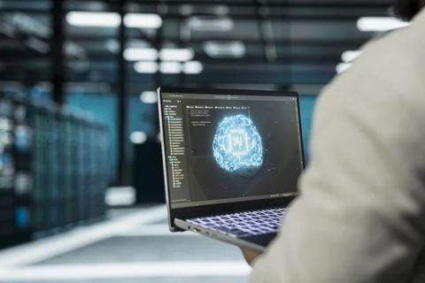 Close up of data center programmer using AI software on laptop Foto stock
