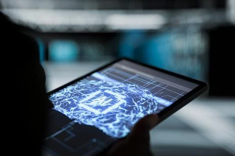 Close up of data center programmer using AI tech on tablet Foto stock