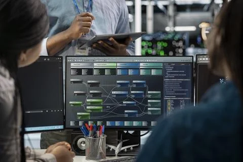 Close up of data center programmers using PC to visualize AI neural networks Stock Photos