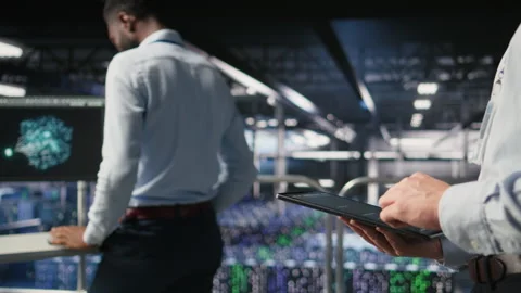 Close up of data center software developer doing maintenance tasks on tablet Video stock 310277606