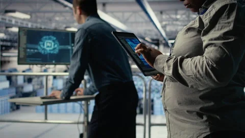 Close up of data center system administrators deploying deep learning software Stock Footage 314805152