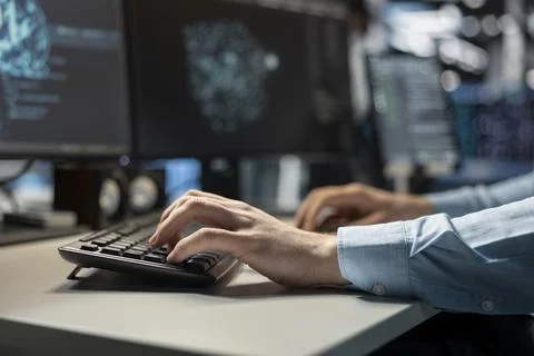 Close up of data center technician coding on PC to update servers tech 스톡 사진