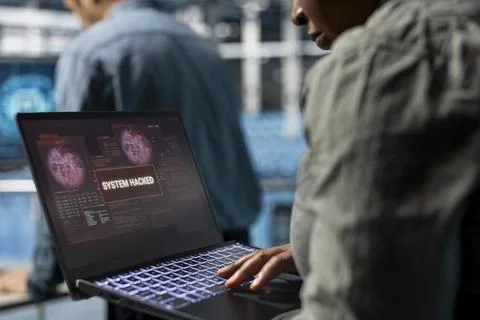 Close up of data center technician trying to minimize hacker damage Stock Photos