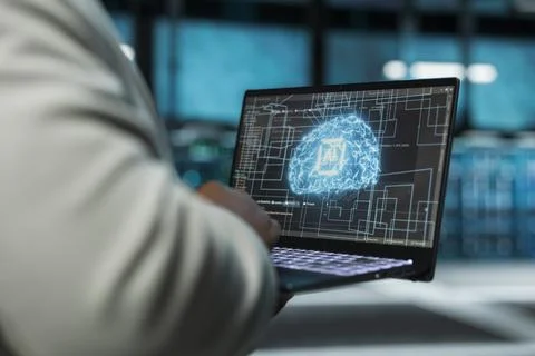 Close up of data center technician using artificial intelligence on laptop Stock Photos