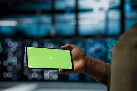Close up of data center technician using isolated screen smartphone Stock Photos