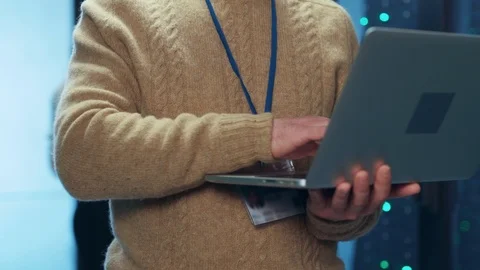 Close-up data specialist tying on laptop keyboard statistics cloud-based Stock Footage 125757571