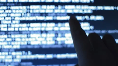 Close-up data web developer analyzing code on his computer Stock Footage 200117458