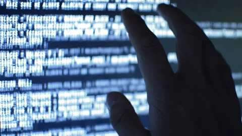 Close-up data web developer analyzing code on his computer Stock Footage 200117465