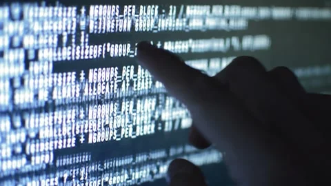 Close-up data web developer analyzing code on his computer Stock Footage 200118212