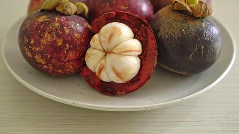 Close-up of dates stuffed with nuts on a white plate Stock Photos
