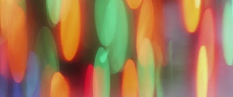 Close-up of de-focused christmas lights bokeh 4k anamorphic video Stock Footage 317932044