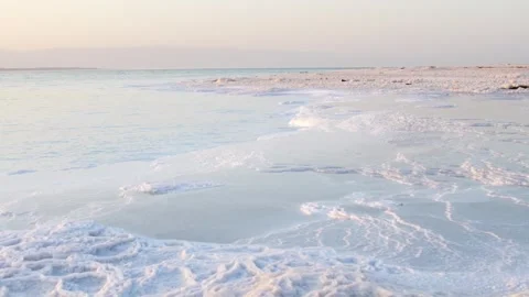 Close up Dead Sea salt crystals on shoreline beach in Jordan at sunset with.. Stock-Footage 330328845