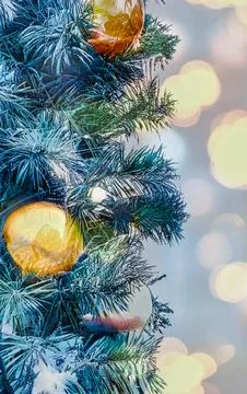 Close up of decorated Christmas tree branches with ornaments and bokeh ligh.. Stock Photos