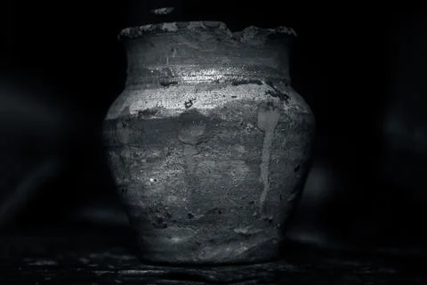 Close up of a decorated earthen pot isolated on black. Stock Photos