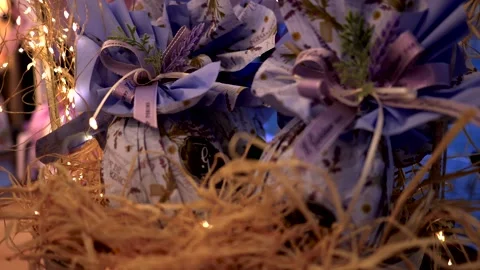 Close up, Decorated Easter eggs in a straw basket. Pastry shop. Video 4K 스톡 동영상 331451701