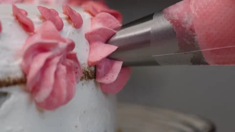 Close up of decorating a cake with cream cheese with special kitchen tool. Stock Footage 340907604