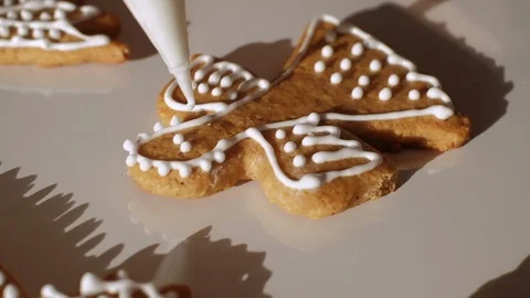 Close up decorating of Christmas gingerbread cookie in shape of angel. Stock Footage 121647627
