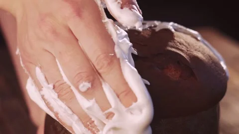 Close-up decoration of the Easter cake with icing sugar on the dark background Stock Footage 151361285