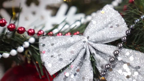 Close-up, decorations on Christmas tree, chaotic camera movement around tree. 4k Stock Footage 219546842