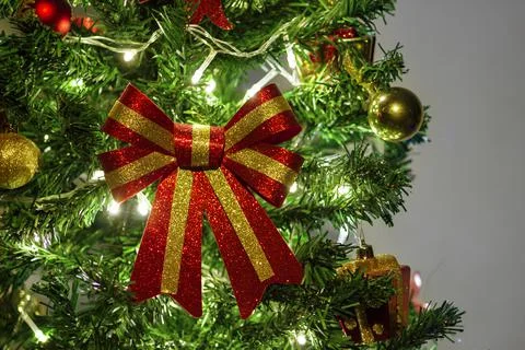Close up of decorations on a Christmas tree with lights on. Selective focus Stock Photos