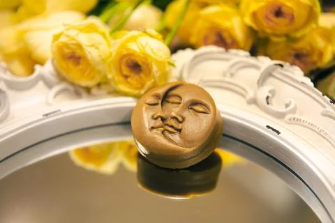 Close-up, decorative candle in the shape of the sun and moon. Stock Photos