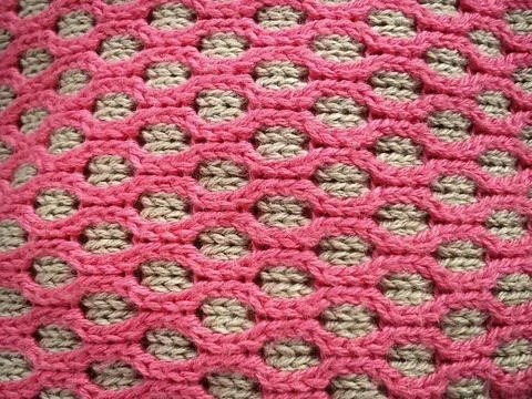 Close-up of decorative knitting. Machine or neat hand-knitted thing. The basi Stock Photos
