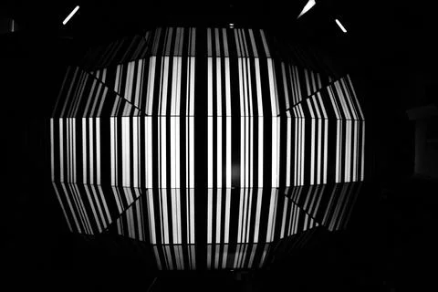 Close-up of a decorative light fixture with multiple colorful objects suspended Stock Photos