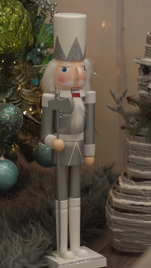 Close-up of decorative nutcracker and snowman figures decorating Christmas tree 스톡 동영상 344631150