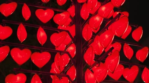 Close up of Decorative Red Heart Light Tree Installation at Night Stock-Footage 338369421