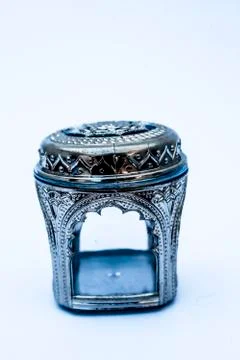 Close up of decorative small container isolated on white with silver cover on Fotos de archivo