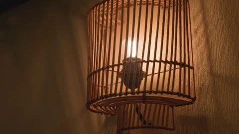 Close up decorative wall light casting shadow on textured surface Stock Footage 310750671