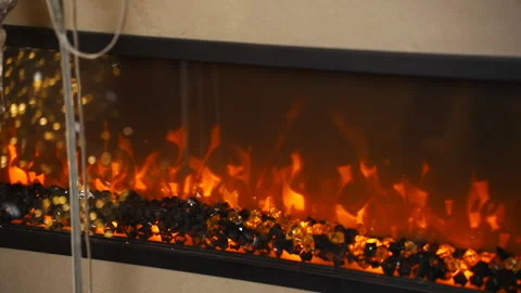 Close up of decorative wall mounted electric fireplace with imitation flames Stock Footage 312627656