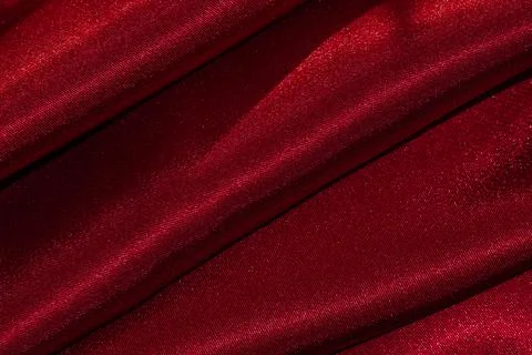 Close up of deep dark red draped textile material. Stock Photos