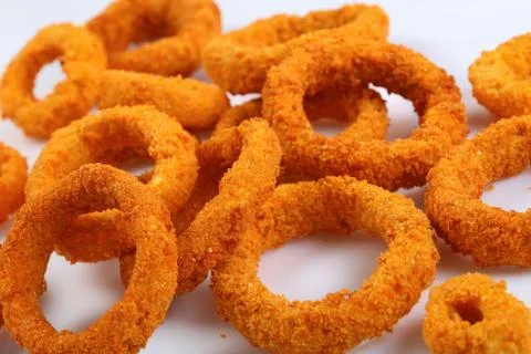 Close-up of deep fried crispy onion rings Foto stock