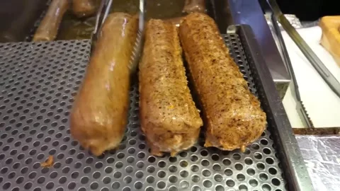 Close Up of Deep Fried Korean Fish Cake Eomuk Bars in Boiling Oil Stock Footage 337374733