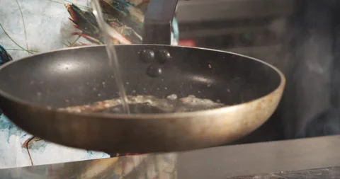 Close-up of a deep frying pan with boiling oil. Chef preparing in the kitchen Stock Footage 134278122