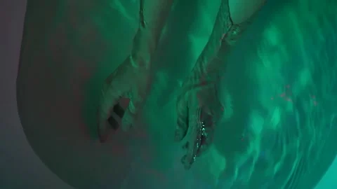 Close-up of delicate female hands that are in the bathroom under water under 库存影片 134739769