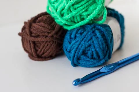 Close up of delicate multi colored woollen yarns displayed on white backgroun Stock Photos