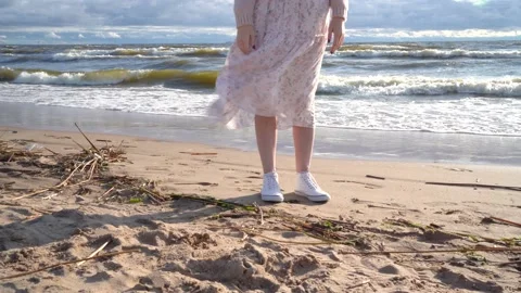 Close-up delicate summer dress develops from the wind. The girl stands by the Video stock 161240099