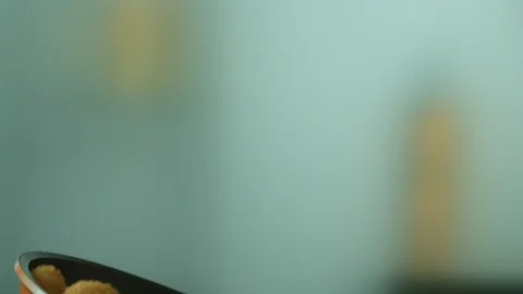 Close-up of delicious appetizing nuggets fried in pan and tossed during cooking Stock Footage 116874619