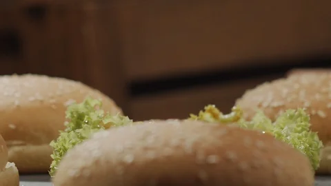 Close-up of delicious beef cutlet drops on spinning plate. Slow motion video Stock Footage 124130282