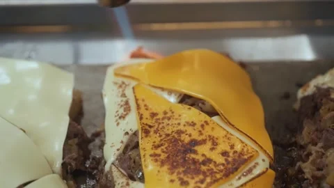 Close-up of Delicious Birria Tacos Preparation, Melting Cheese on Meat with a To Stock Footage 331636645