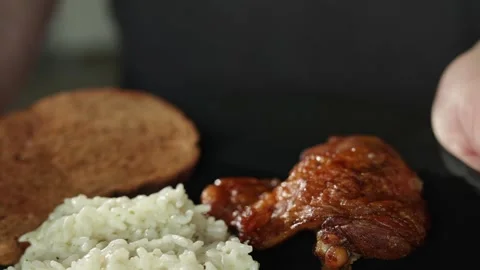 Close-up of a delicious chicken wing meal with rice and toast Stock Footage 340264357